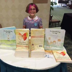 Sage selling her Mom's books at TMA conference